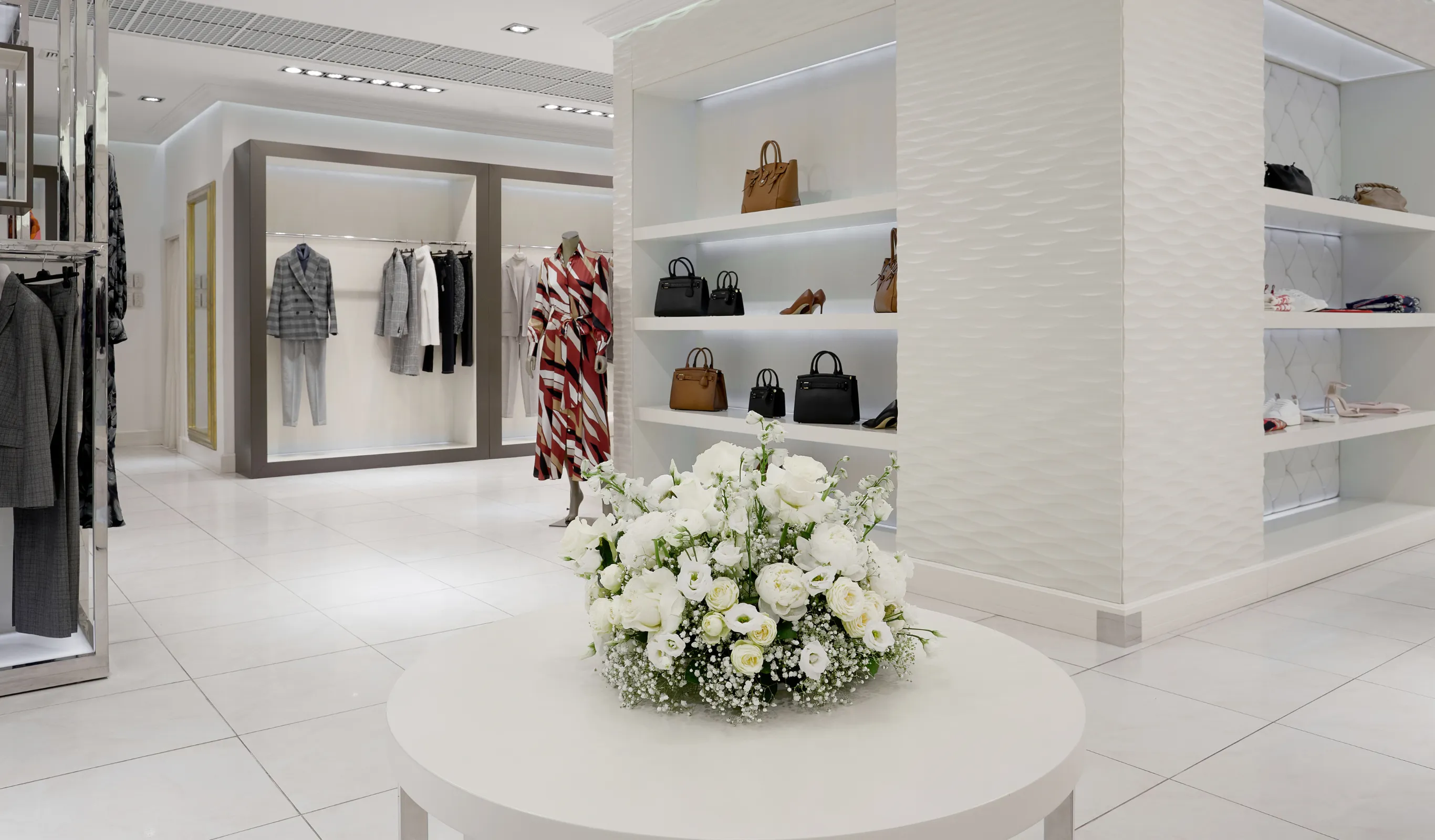 After view of a Los Angeles commercial remodeling project with updated retail interior, improved lighting, modern display walls, polished flooring, and professional business space design