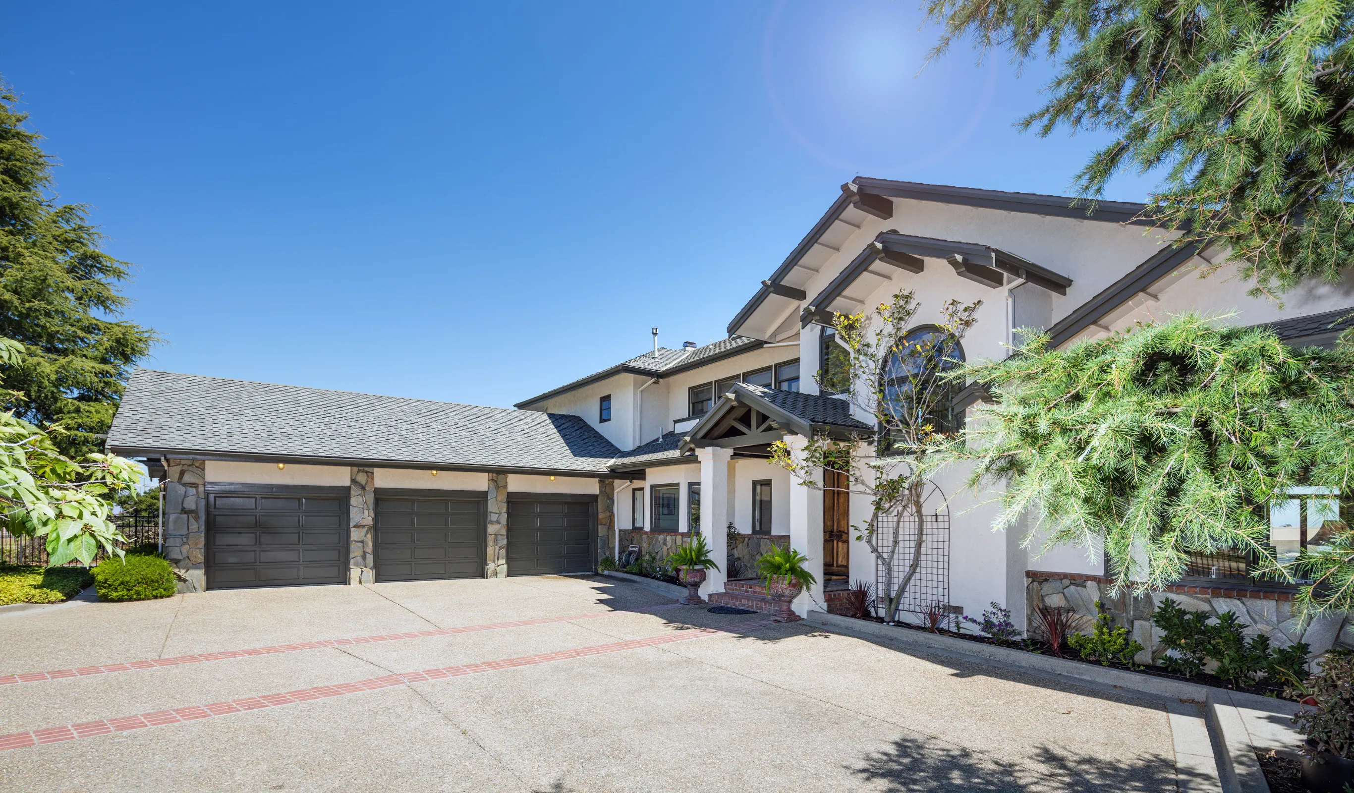 Before view of a Los Angeles garage before conversion into an ADU with original garage doors, driveway access, existing exterior, and unused conversion potential
