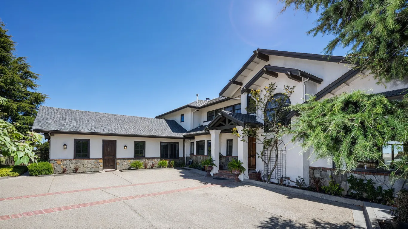 Garage conversion ADU project in Los Angeles with converted detached structure, private entry, updated exterior, driveway access, and added residential living space