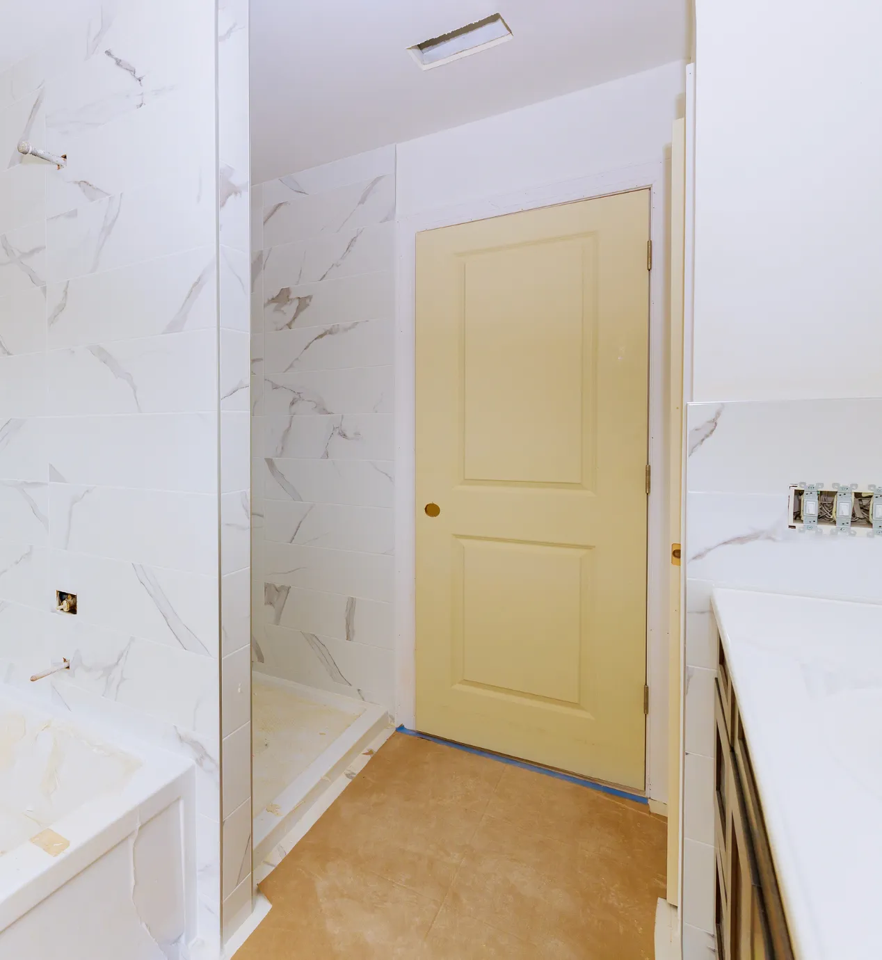 Los Angeles bathroom remodeling project with walk-in shower tile installation, vanity placement, wall tile, and interior renovation work